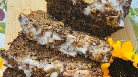 Loaf of Rustic Tuscan Banana Bread with a golden crust and bananas
